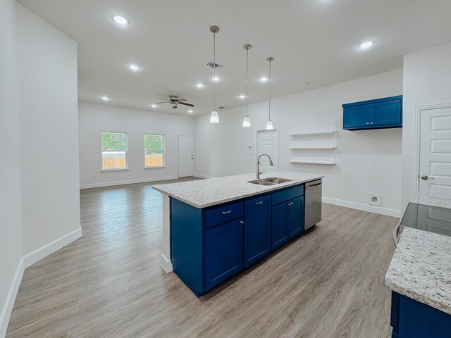 kitchen with blue cabinetry, a sink, light wood-style floors, and dishwasher