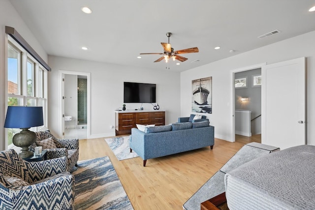 living area with visible vents, baseboards, ceiling fan, recessed lighting, and light wood-type flooring