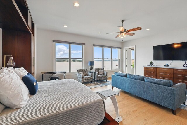bedroom with recessed lighting, ceiling fan, and light wood-type flooring