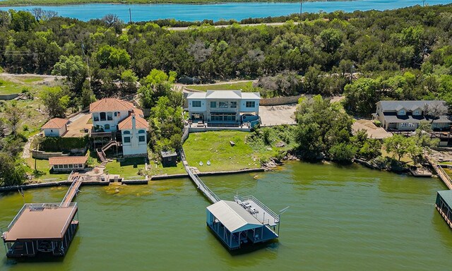 aerial view featuring a water view and a view of trees