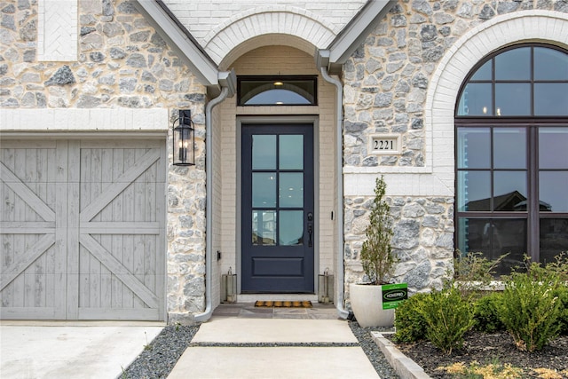 property entrance with stone siding