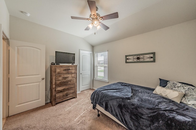 carpeted bedroom featuring ceiling fan and lofted ceiling
