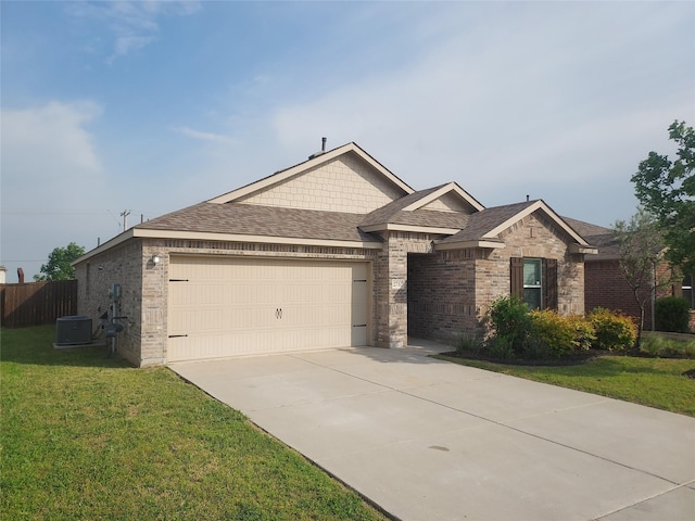 ranch-style home featuring a shingled roof, an attached garage, brick siding, a front yard, and concrete driveway