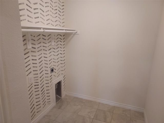 laundry room with baseboards, laundry area, and electric dryer hookup