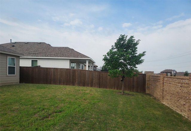 view of yard featuring a fenced backyard