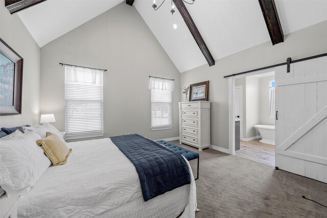 bedroom with beamed ceiling, baseboards, high vaulted ceiling, a barn door, and carpet