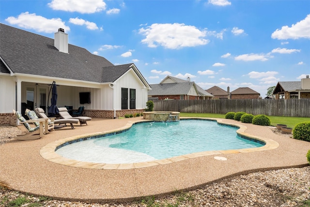 view of swimming pool with a patio, a fenced backyard, an in ground hot tub, and a fenced in pool