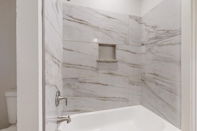 bathroom with shower / bathing tub combination