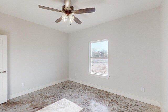 unfurnished room featuring baseboards and ceiling fan
