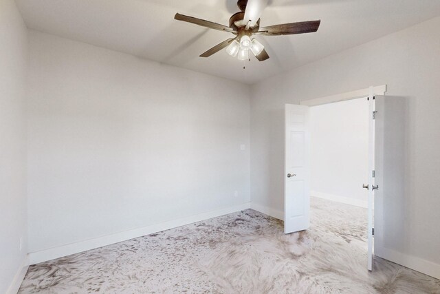 unfurnished room with baseboards and a ceiling fan