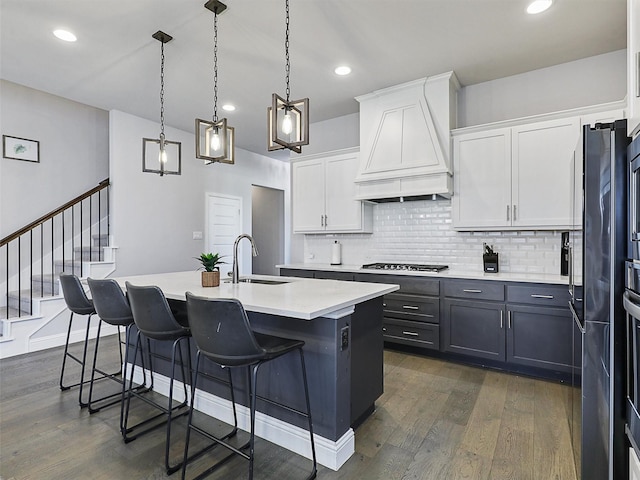 3222 Roy Alton, Melissa, TX 75454 - kitchen with premium range hood, light countertops, white cabinets, a sink, and dark wood finished floors