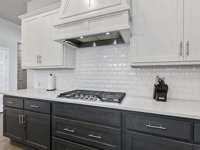 3222 Roy Alton, Melissa, TX 75454 - kitchen with white cabinets, light stone counters, premium range hood, stainless steel gas stovetop, and backsplash
