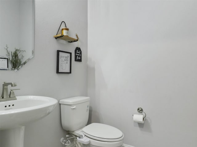 3222 Roy Alton, Melissa, TX 75454 - bathroom with baseboards, a sink, and toilet