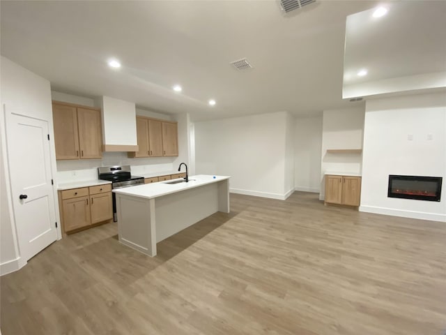 kitchen with recessed lighting, a sink, visible vents, and stainless steel electric range oven