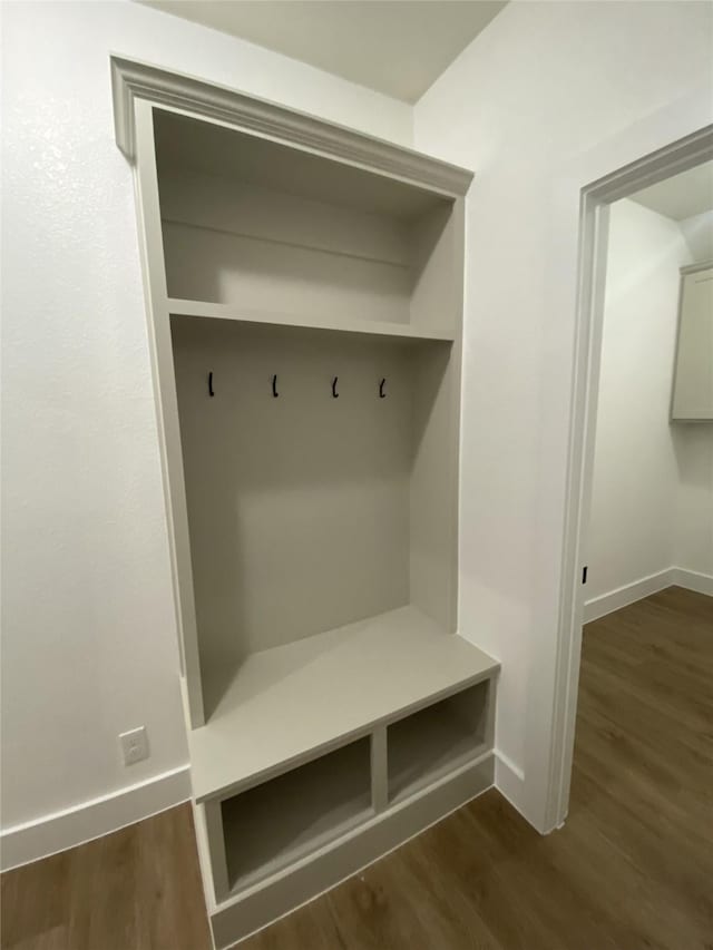 mudroom with baseboards and dark wood-style floors
