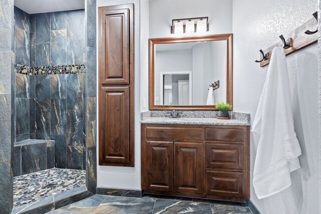 full bath featuring vanity and walk in shower