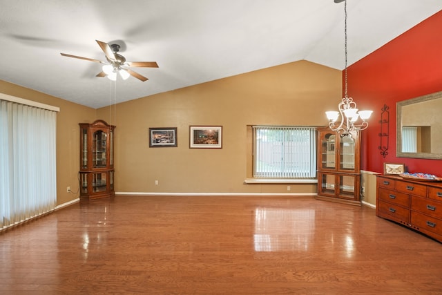 2609 Kimberly Dr, Garland, TX 75040 - interior space featuring baseboards, ceiling fan with notable chandelier, wood finished floors, and vaulted ceiling