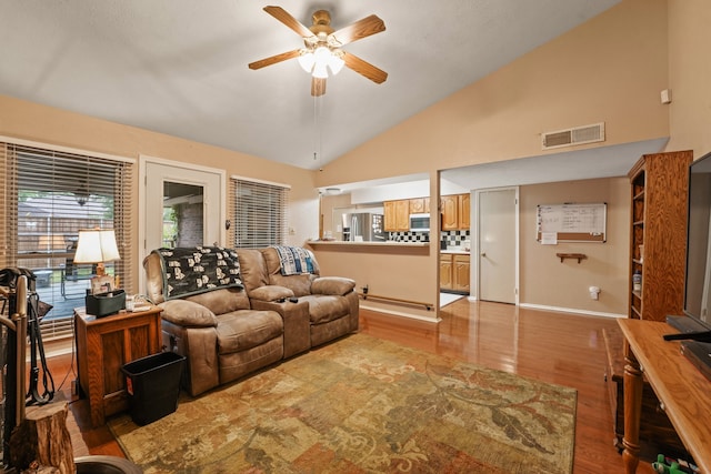 2609 Kimberly Dr, Garland, TX 75040 - living room featuring ceiling fan, baseboards, vaulted ceiling, light wood-type flooring, and visible vents