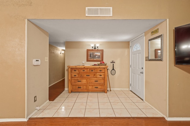 2609 Kimberly Dr, Garland, TX 75040 - entryway featuring light tile patterned flooring, baseboards, and visible vents
