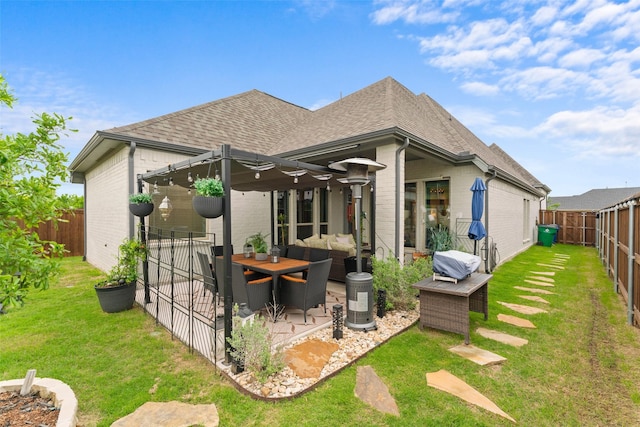 8321 Pine Island Way, Mckinney, TX 75071 - rear view of house featuring brick siding, roof with shingles, a patio area, and an outdoor hangout area