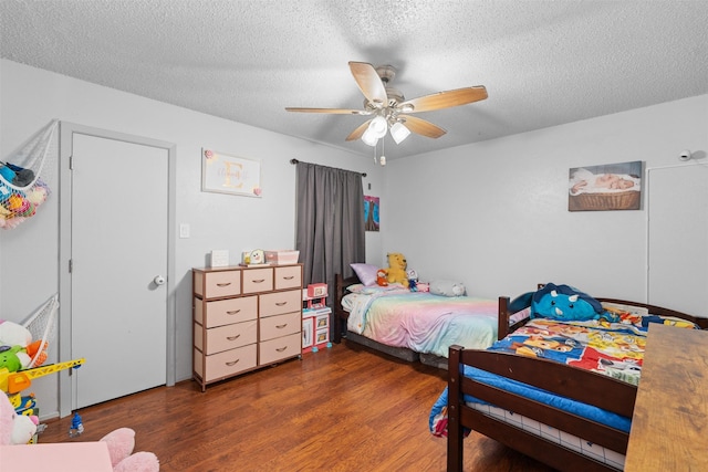4212 Selina Ct, Arlington, TX 76016 - bedroom featuring wood finished floors, a textured ceiling, and ceiling fan