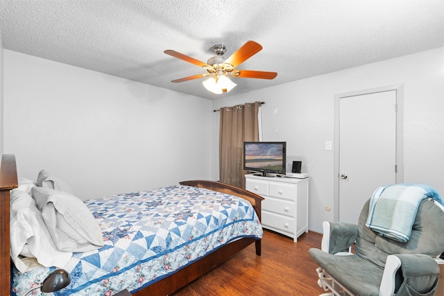 4212 Selina Ct, Arlington, TX 76016 - bedroom with wood finished floors, ceiling fan, and a textured ceiling