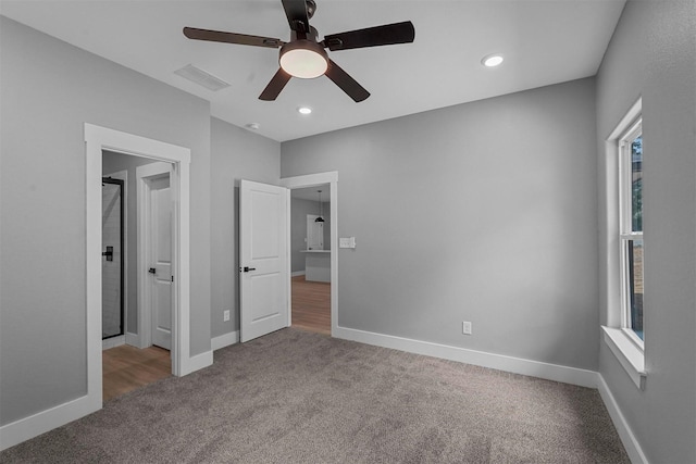 unfurnished bedroom with a ceiling fan, visible vents, carpet floors, baseboards, and recessed lighting