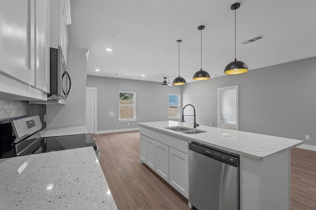 kitchen featuring a ceiling fan, visible vents, a sink, white cabinets, and stainless steel appliances