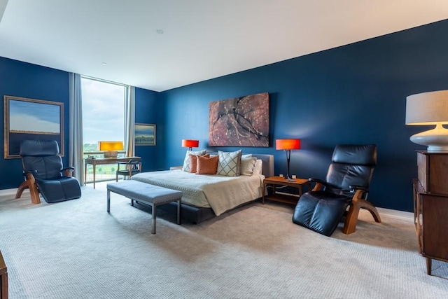carpeted bedroom featuring expansive windows