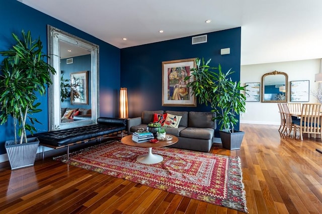 interior space featuring visible vents, recessed lighting, baseboards, and wood finished floors