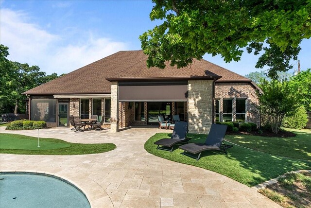 8230 County Road 530, Mansfield, TX 76063 - rear view of property with brick siding, a patio, a shingled roof, and a lawn