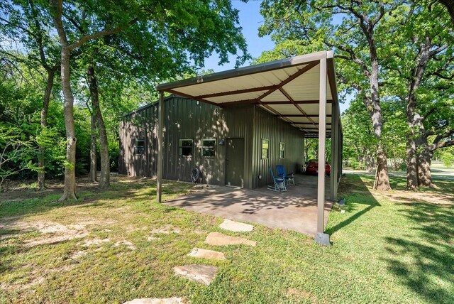 8230 County Road 530, Mansfield, TX 76063 - exterior space featuring a lawn, board and batten siding, and a patio area