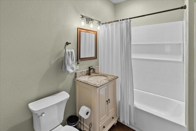 8230 County Road 530, Mansfield, TX 76063 - full bathroom featuring toilet, a textured wall, and shower / tub combo with curtain