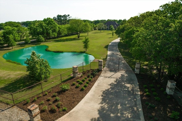 8230 County Road 530, Mansfield, TX 76063 - surrounding community featuring fence, a gate, a water view, and a lawn