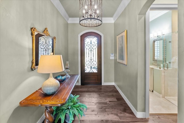 8230 County Road 530, Mansfield, TX 76063 - entryway featuring an inviting chandelier, crown molding, wood finished floors, baseboards, and arched walkways