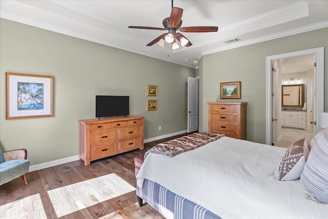 8230 County Road 530, Mansfield, TX 76063 - bedroom with crown molding, visible vents, wood finished floors, baseboards, and ensuite bathroom