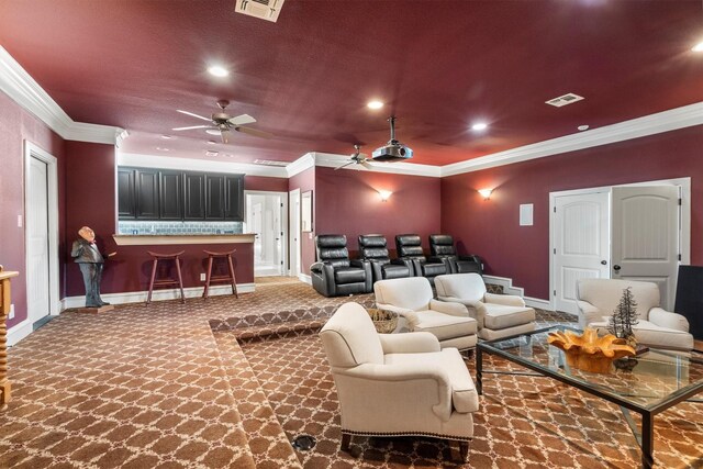 carpeted cinema featuring baseboards, ornamental molding, ceiling fan, and recessed lighting