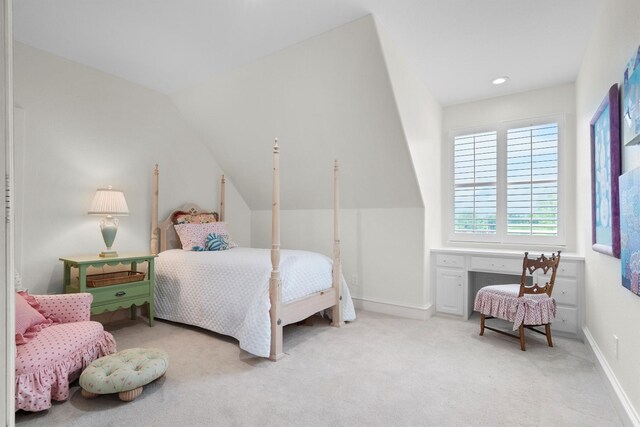 bedroom featuring carpet flooring, baseboards, and vaulted ceiling