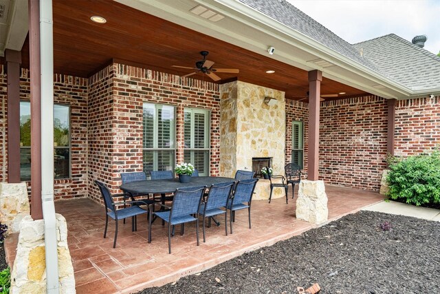 view of patio with outdoor dining space and ceiling fan