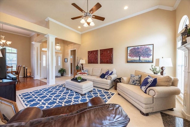 265 Old Spanish Trl, Valley View, TX 76272 - living room with crown molding, baseboards, decorative columns, and ceiling fan with notable chandelier
