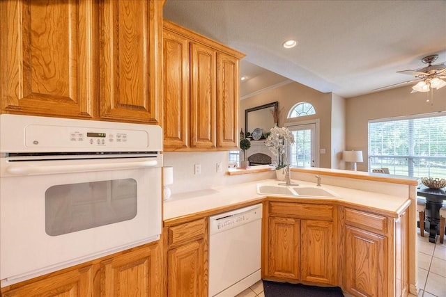 265 Old Spanish Trl, Valley View, TX 76272 - kitchen with a sink, a peninsula, light tile patterned flooring, and white appliances