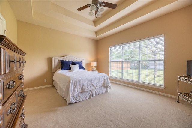 265 Old Spanish Trl, Valley View, TX 76272 - carpeted bedroom featuring a ceiling fan, baseboards, and a tray ceiling