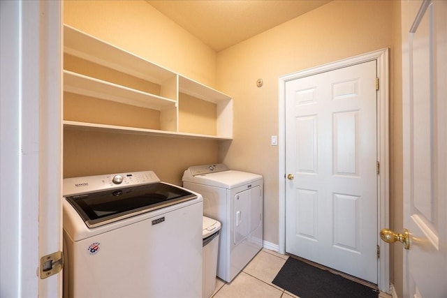 265 Old Spanish Trl, Valley View, TX 76272 - laundry area featuring light tile patterned floors, laundry area, and washing machine and clothes dryer