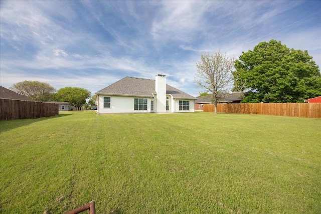 265 Old Spanish Trl, Valley View, TX 76272 - rear view of house featuring fence, a chimney, and a yard