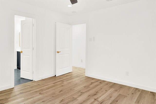 unfurnished room featuring a ceiling fan, baseboards, recessed lighting, and wood finished floors