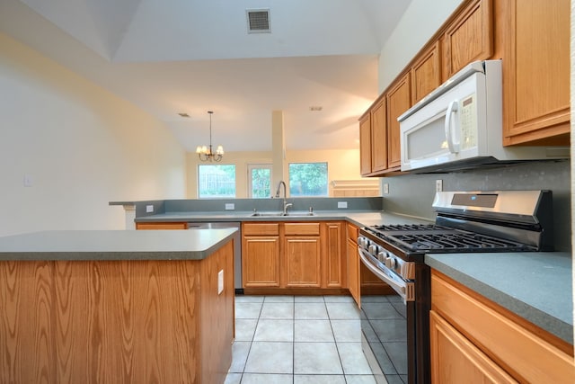 9104 Chesapeake Ln, Mckinney, TX 75071 - kitchen with appliances with stainless steel finishes, a sink, a peninsula, a chandelier, and light tile patterned floors