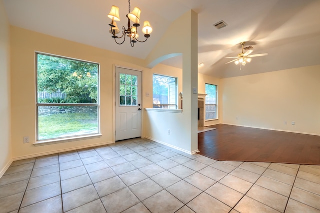 9104 Chesapeake Ln, Mckinney, TX 75071 - doorway with lofted ceiling, light tile patterned floors, a chandelier, ceiling fan, and arched walkways