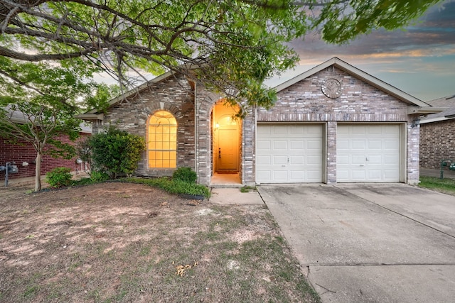 9104 Chesapeake Ln, Mckinney, TX 75071 - view of front of home with concrete driveway, an attached garage, and brick siding