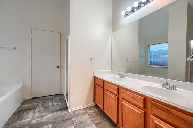 9104 Chesapeake Ln, Mckinney, TX 75071 - full bath with a bath, double vanity, and stone finish floors