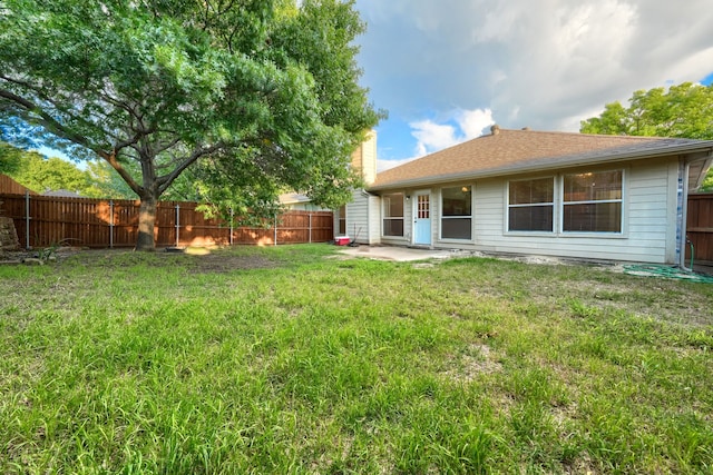 9104 Chesapeake Ln, Mckinney, TX 75071 - rear view of house with a chimney